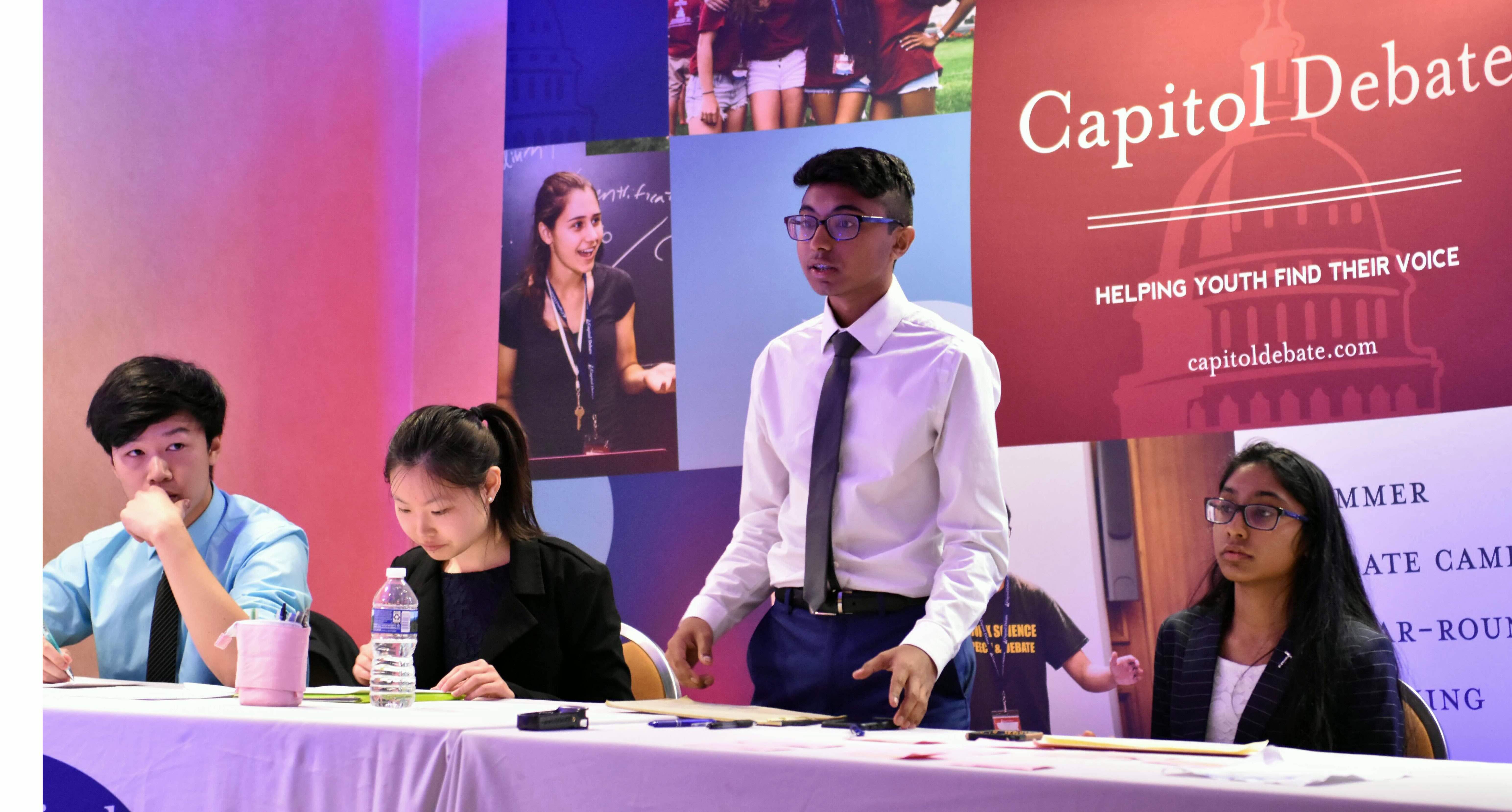 Students in Parliamentary debate setting