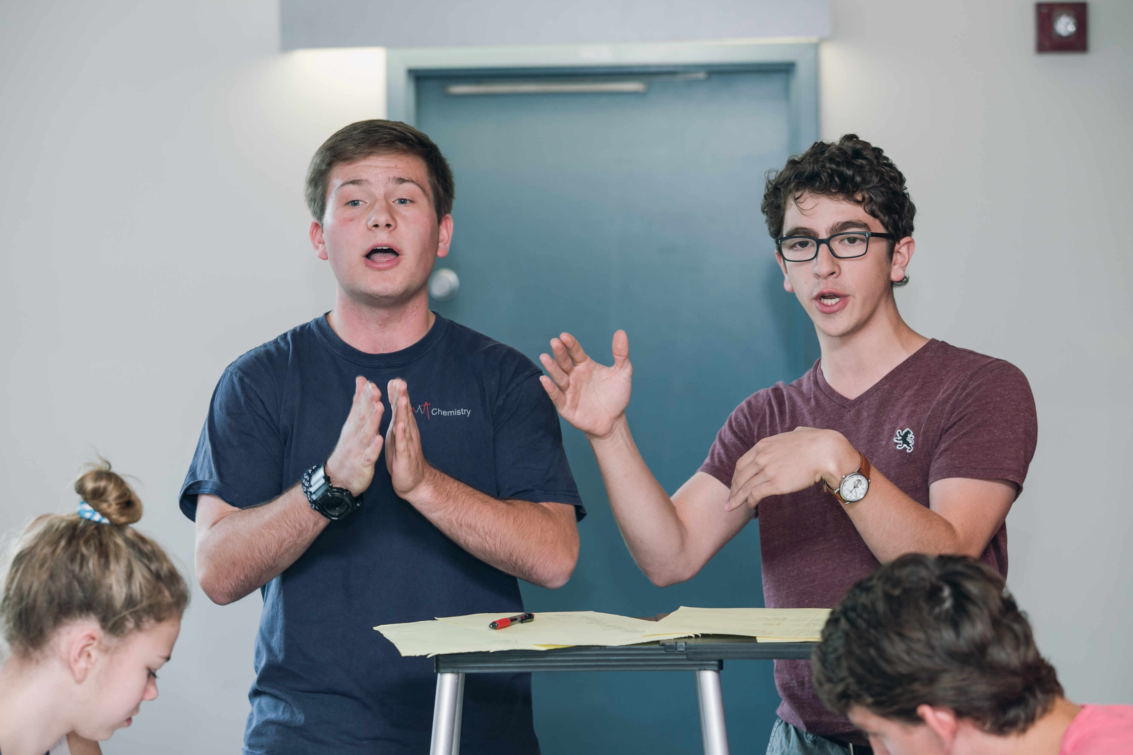 Confident students presenting at summer debate camp