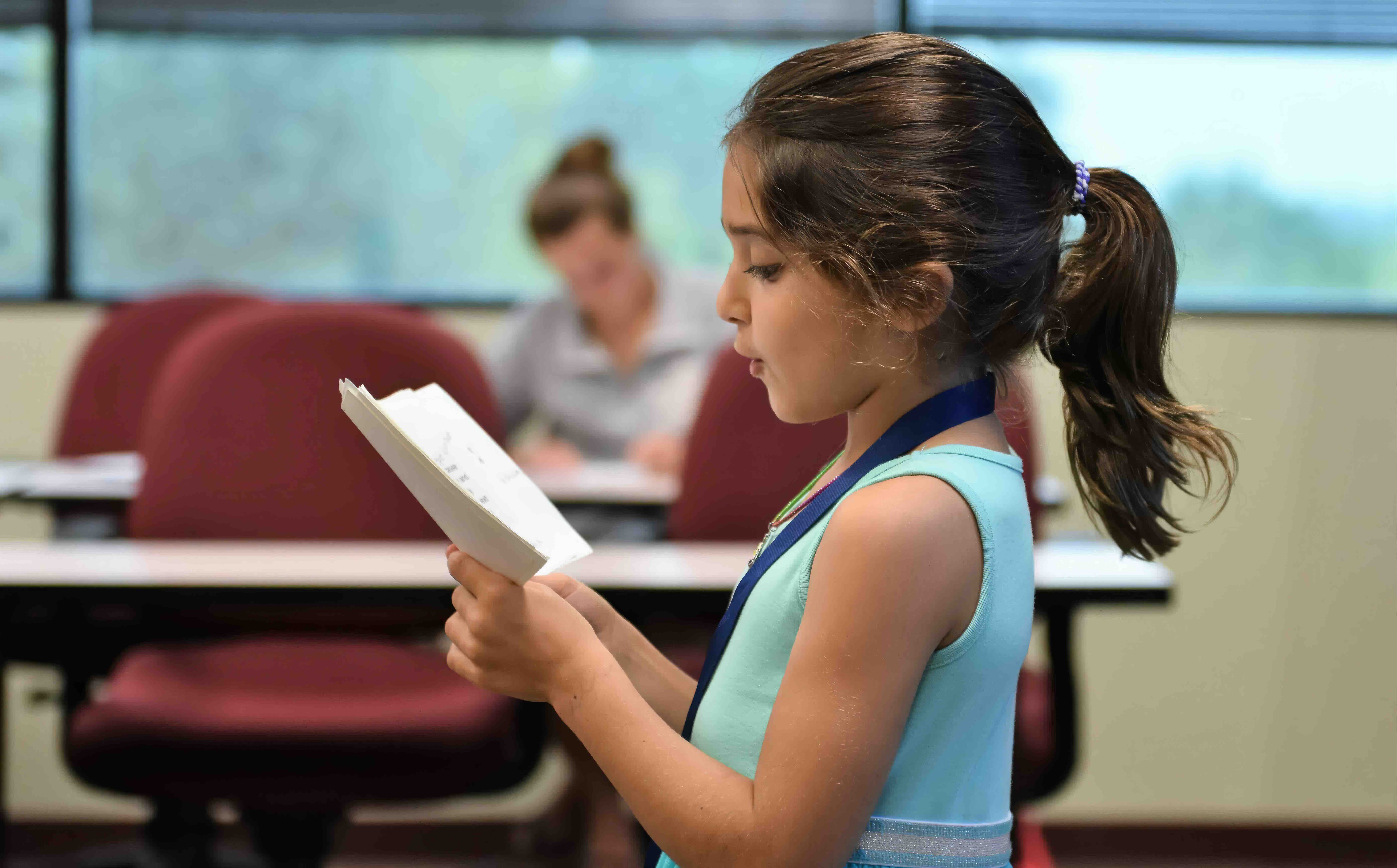 Confident students presenting at summer debate camp