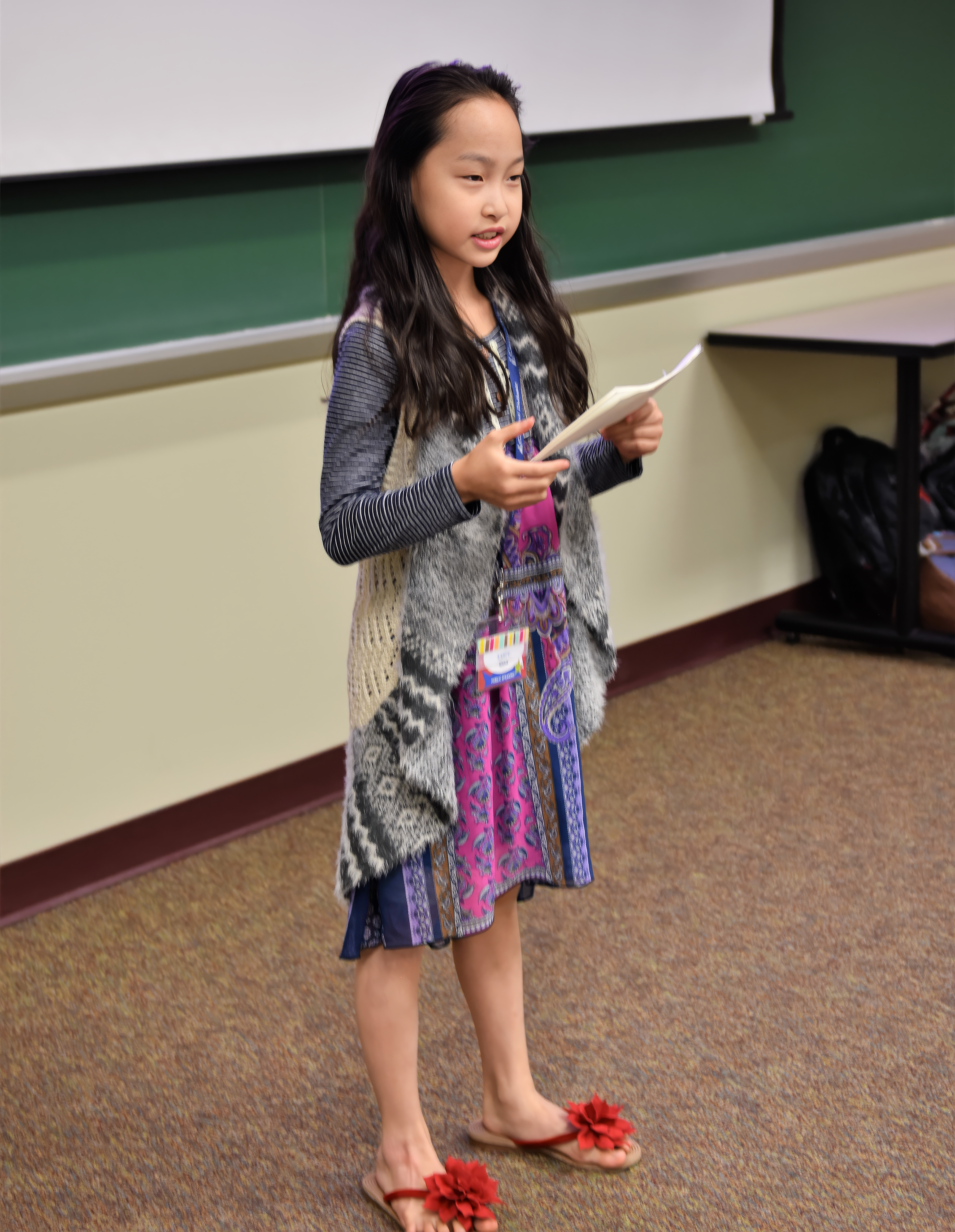 Proud young student presenting at Rookie Camp